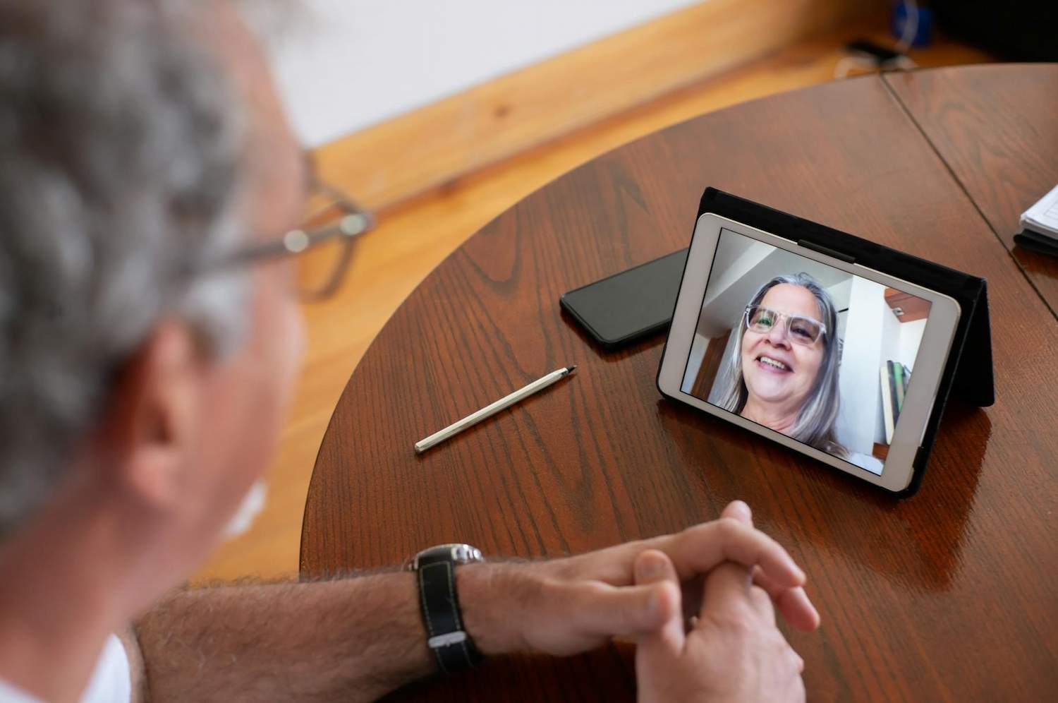 A man on a video call with his long-distance partner.