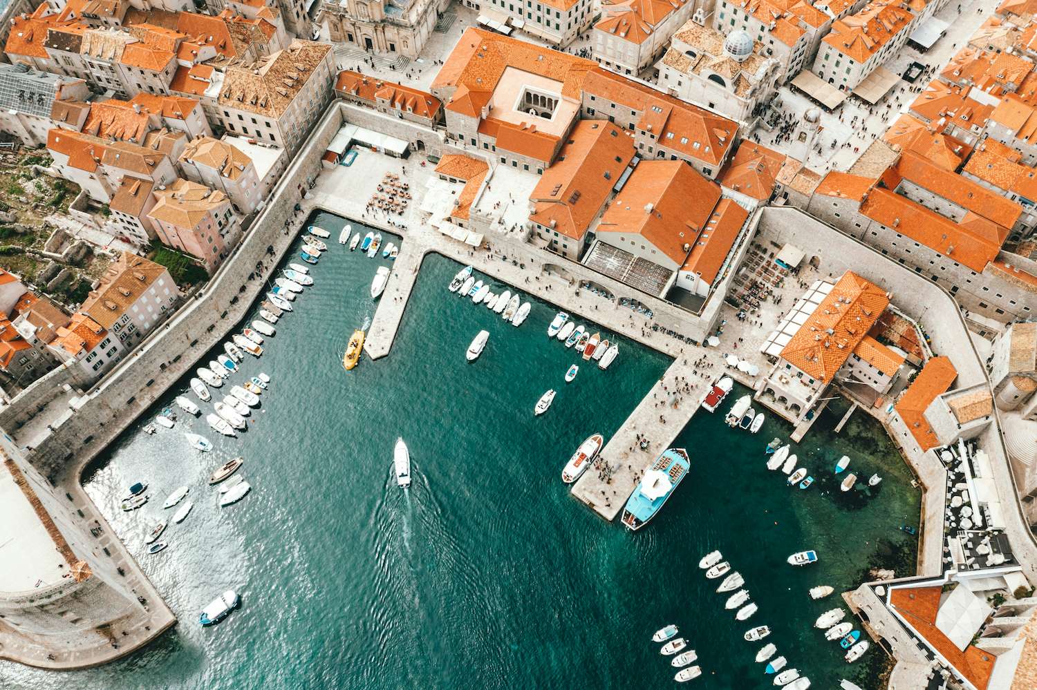 An aerial photograph of the pier full of boats in Croatia which is considered one of the best places to travel in the world