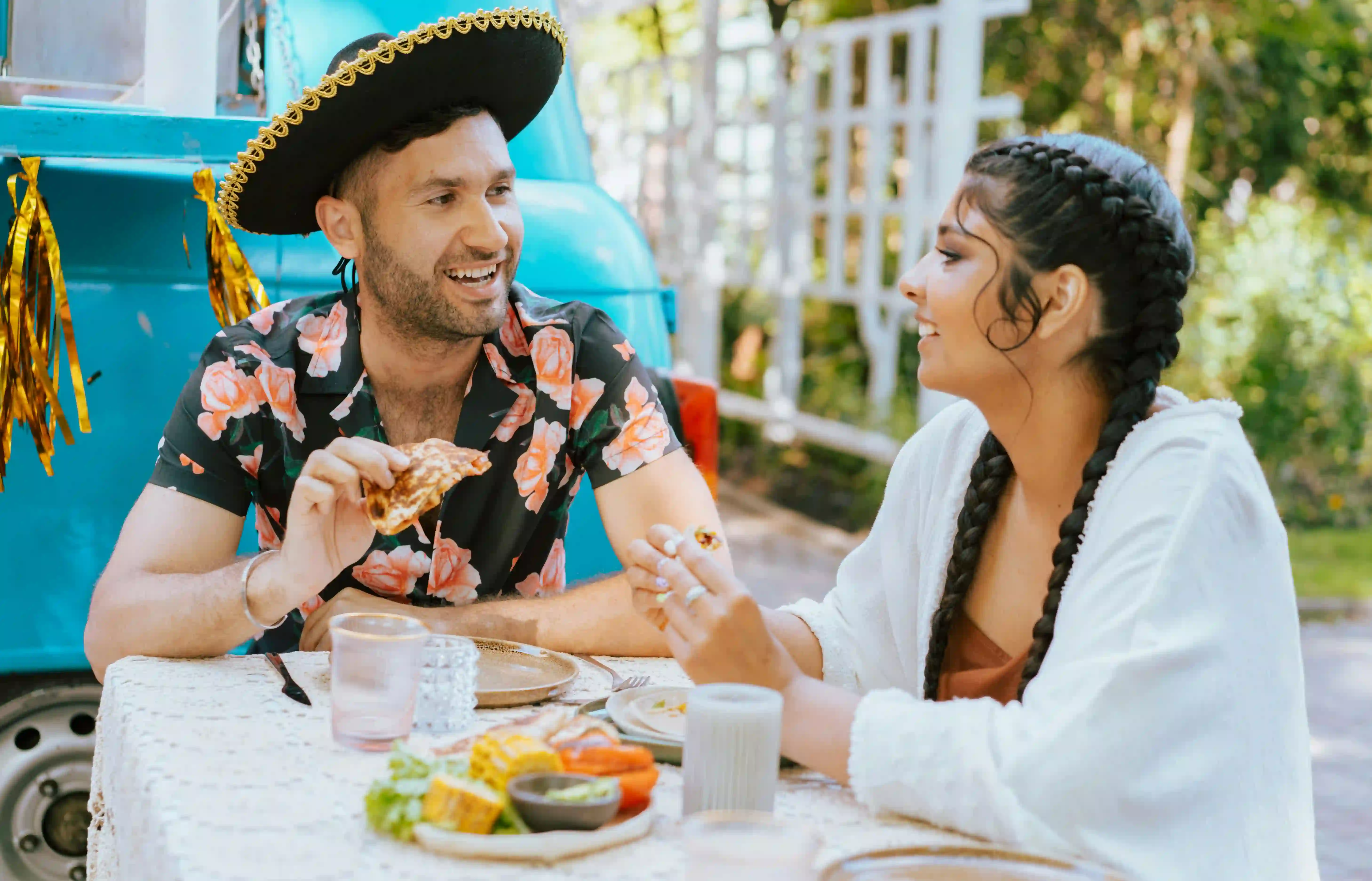 A man having a date with a woman while applying his knowledge of effective conversation starters with a girl