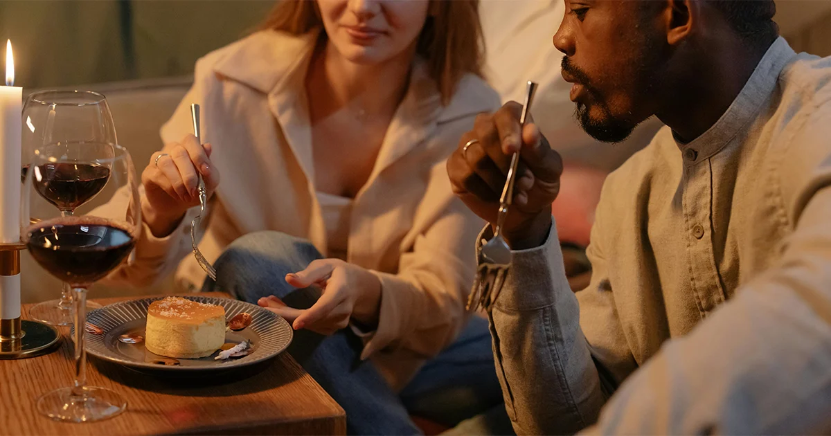 A guy in a brown polo trying out new food with a lady demonstrating how to keep a conversation going with a girl”