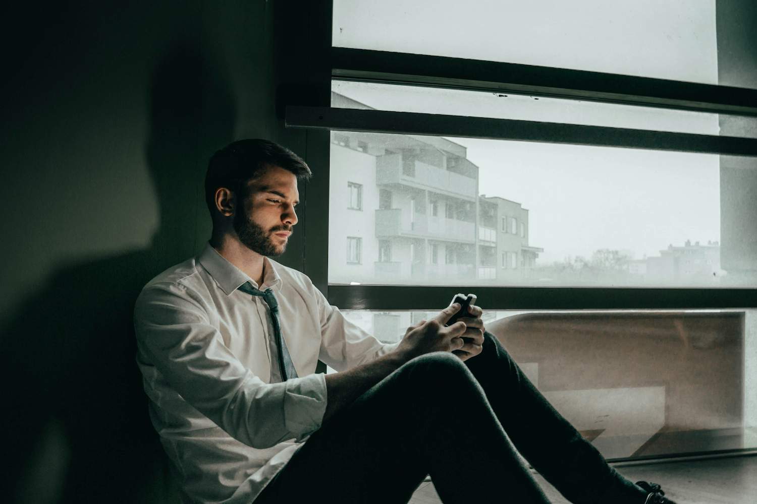 A man sadly wondering how to make long-distance work