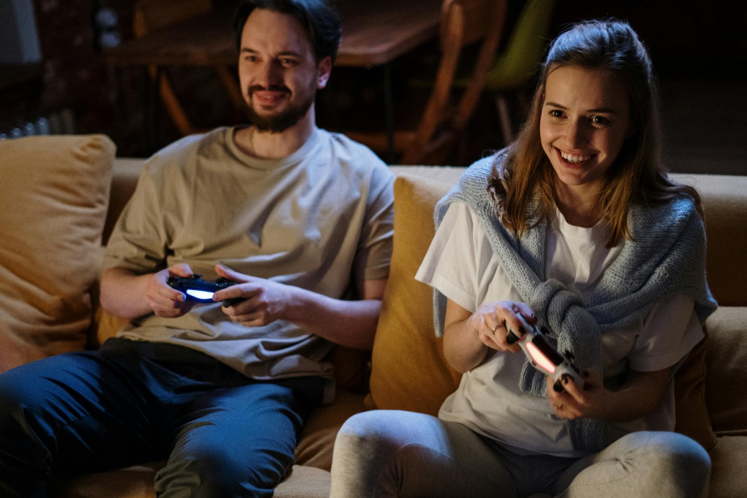 A man and woman playing a video game together.