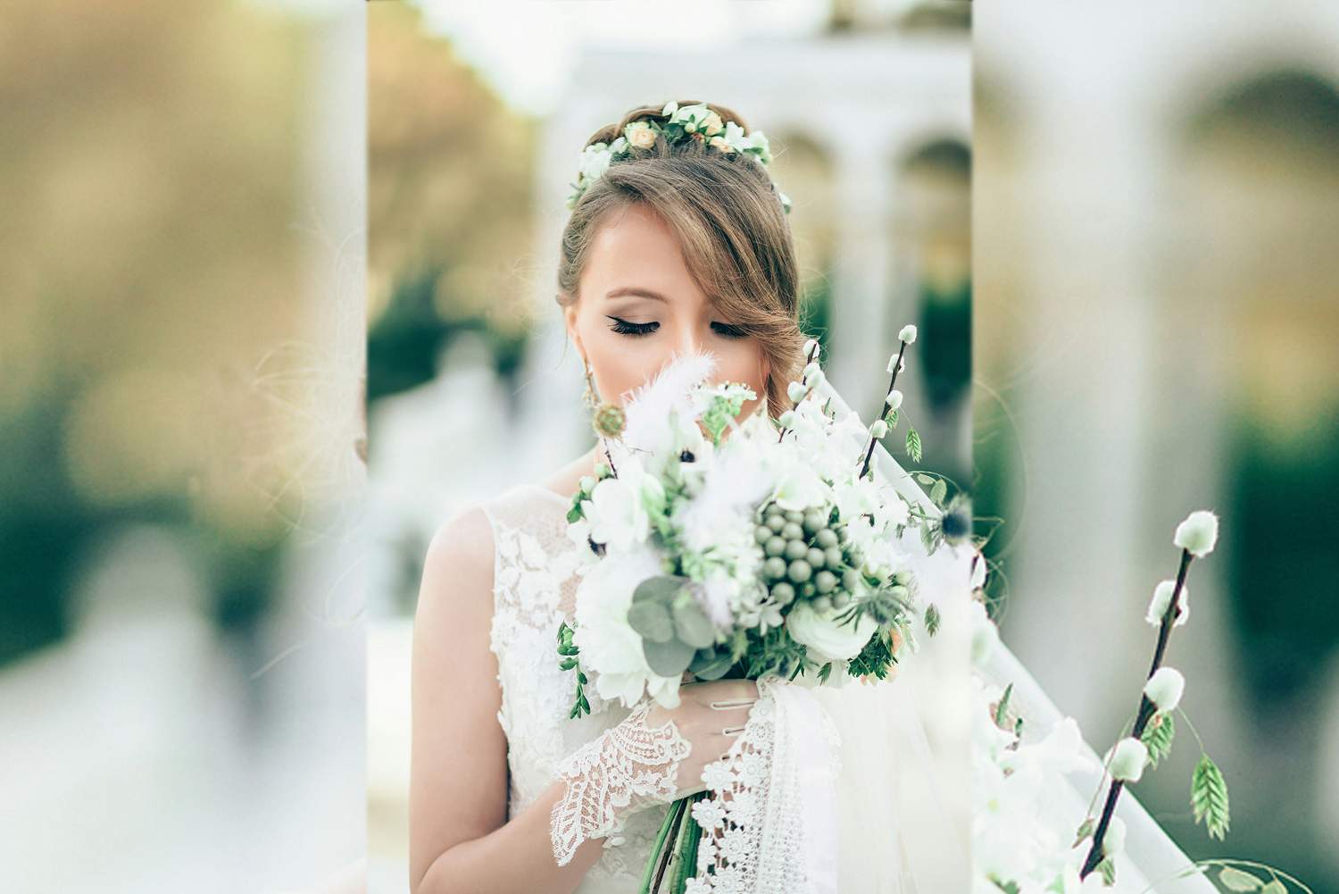 A bride smelling the flowers in her wedding bouquet.