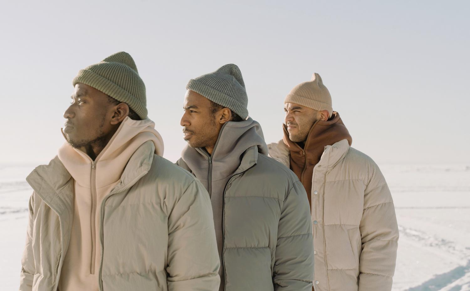 Three men in winter attire