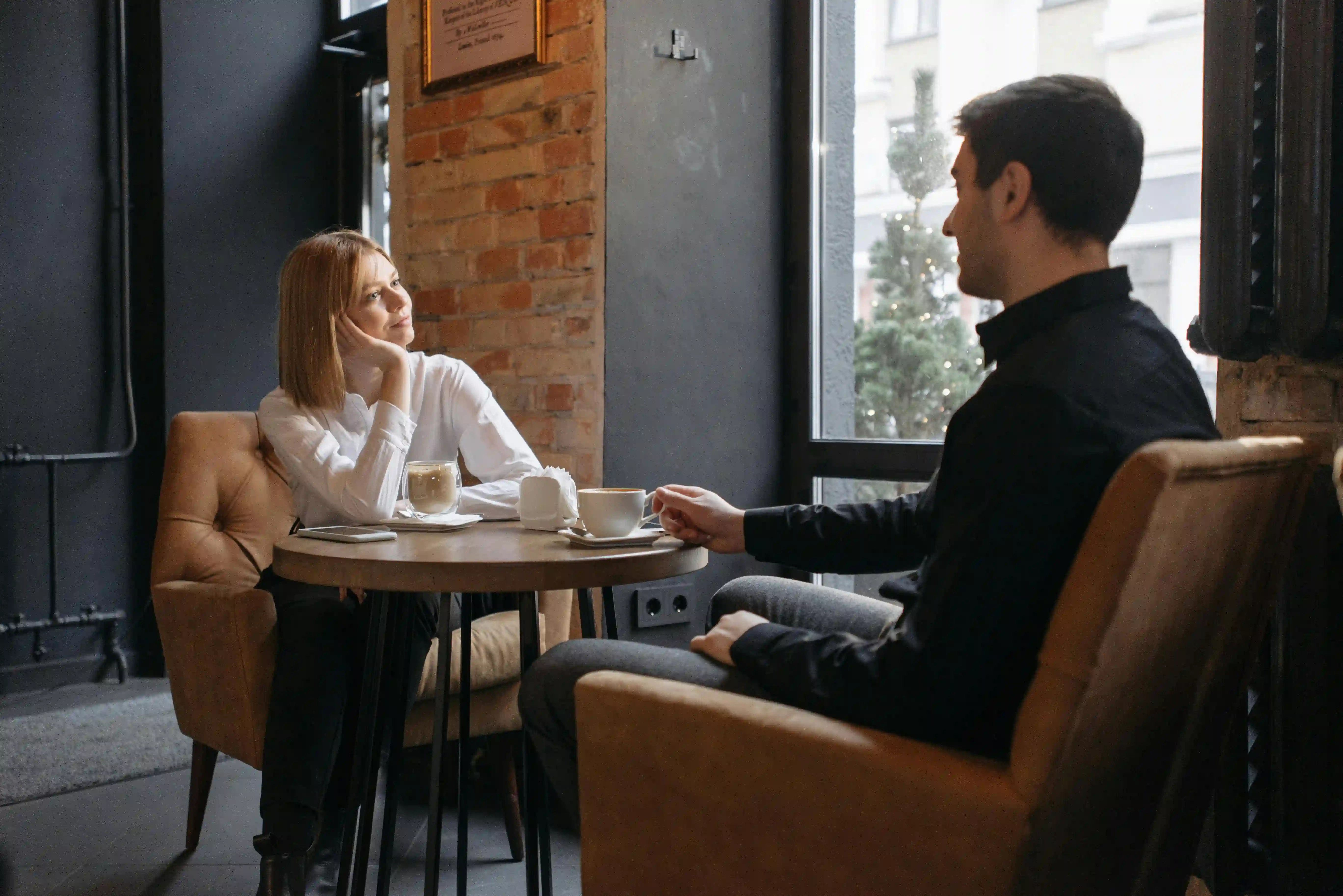 Couple asking questions to each other during their first date